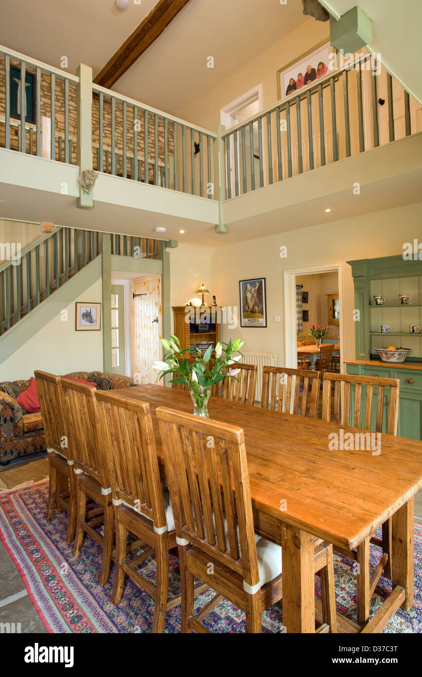 A double height dining room in a converted barn Stock Photo - Alamy