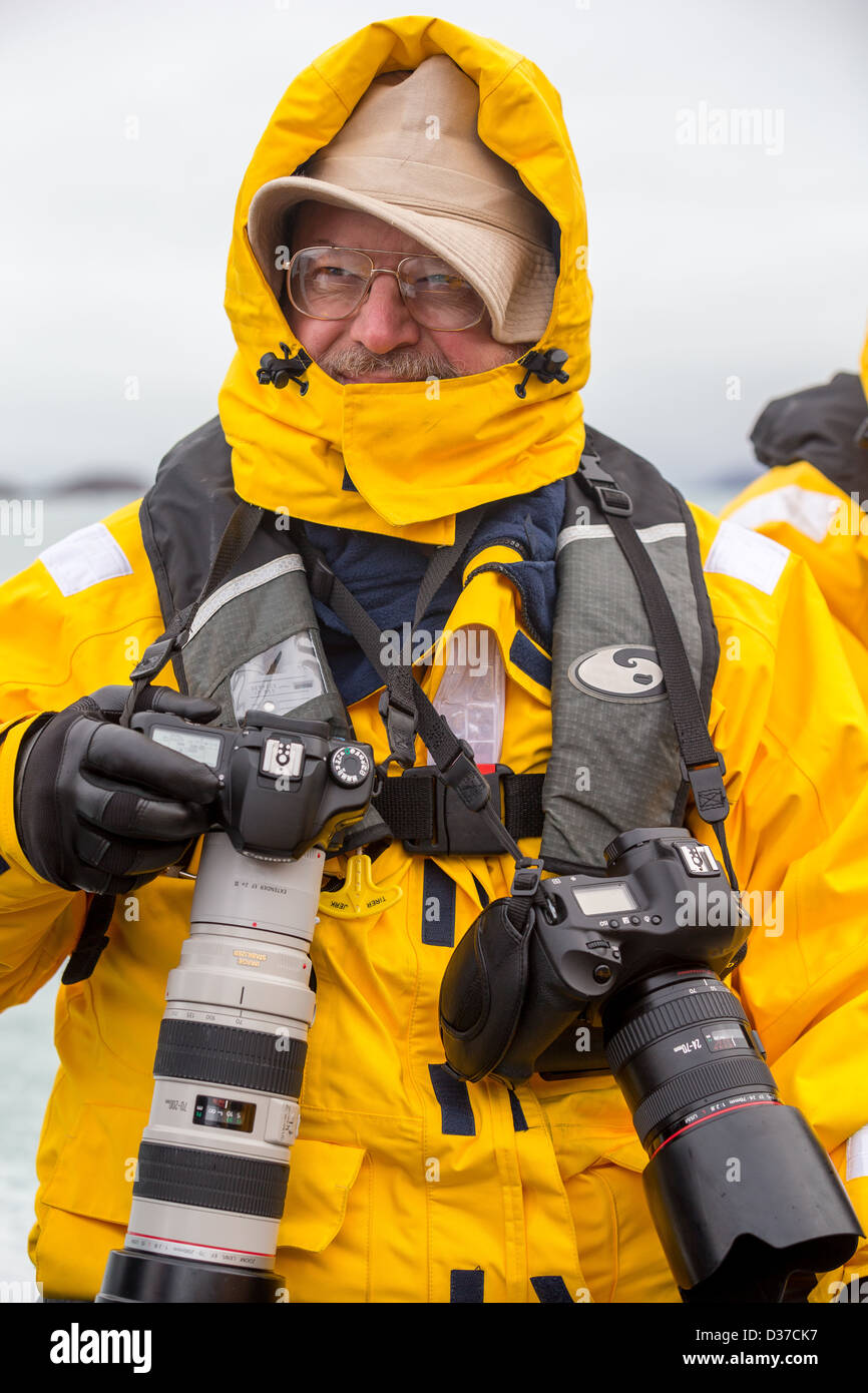 Photographer on cold day in a Zodiacs, Svalbard, Norway Stock Photo