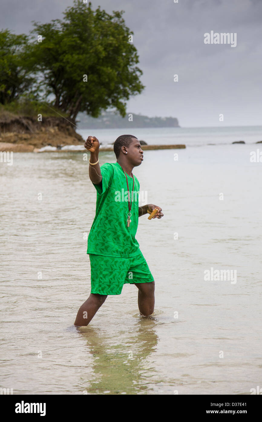 Man casts a hand fishing line from the beach in St Lucia, West Indies Stock  Photo - Alamy