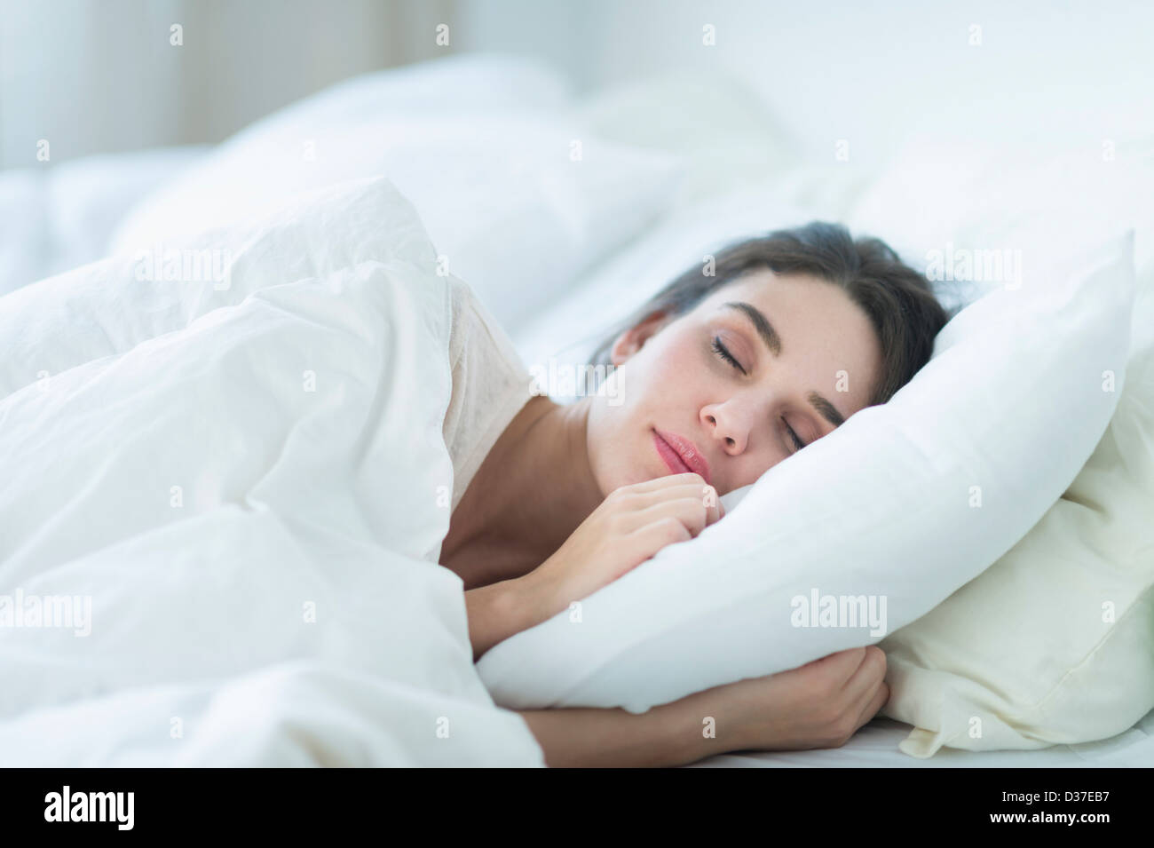USA, New Jersey, Jersey City, Woman sleeping in bed Stock Photo Alamy