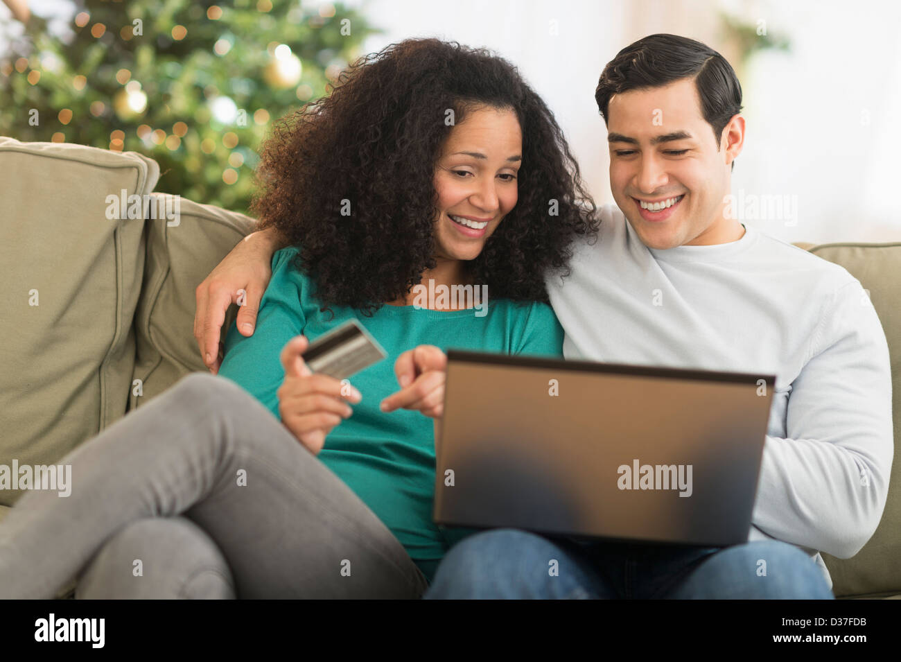 USA, New Jersey, Jersey City, Couple using laptop for online shopping Stock Photo