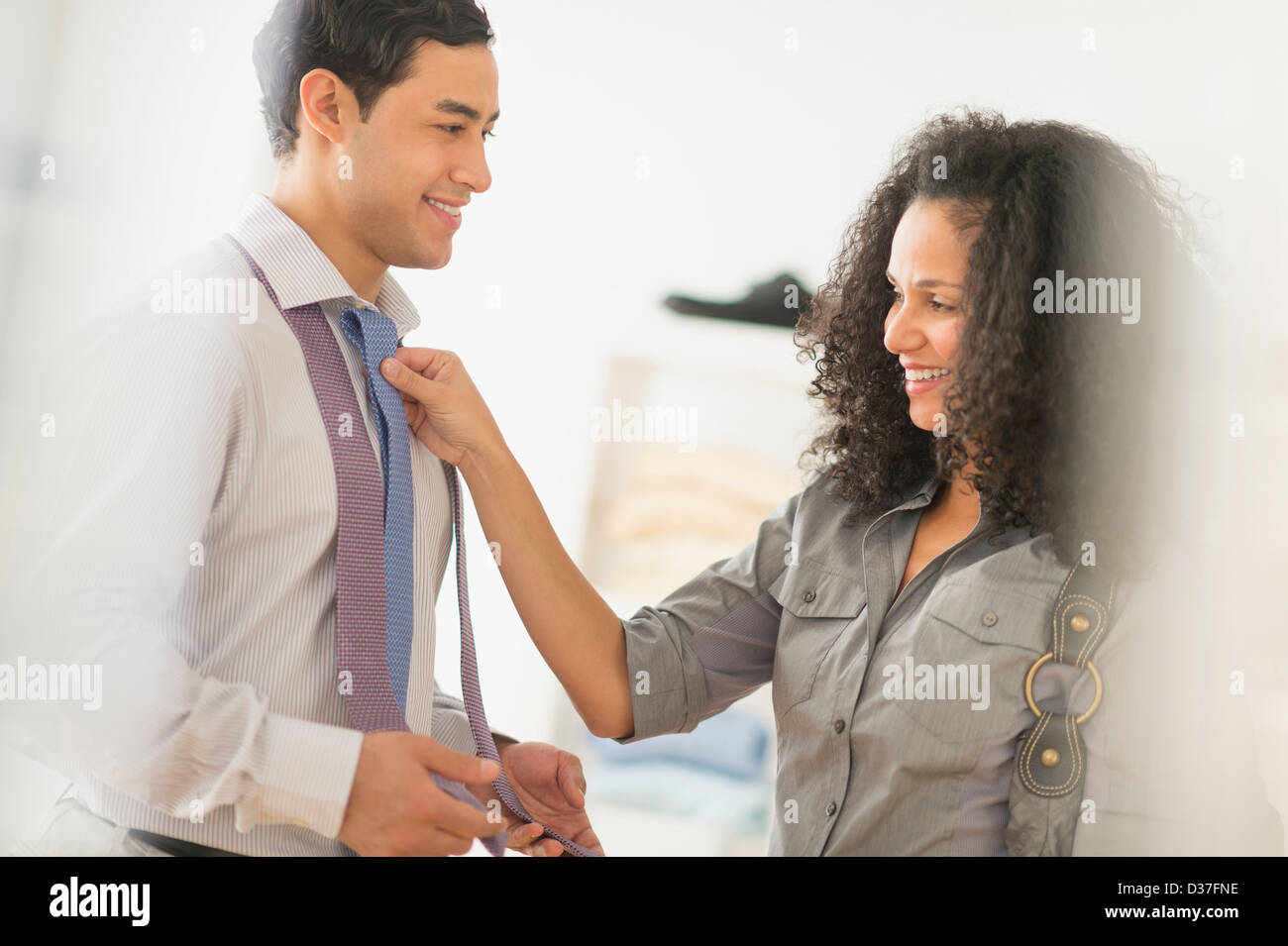 USA, New Jersey, Jersey City, Couple buying tie Stock Photo
