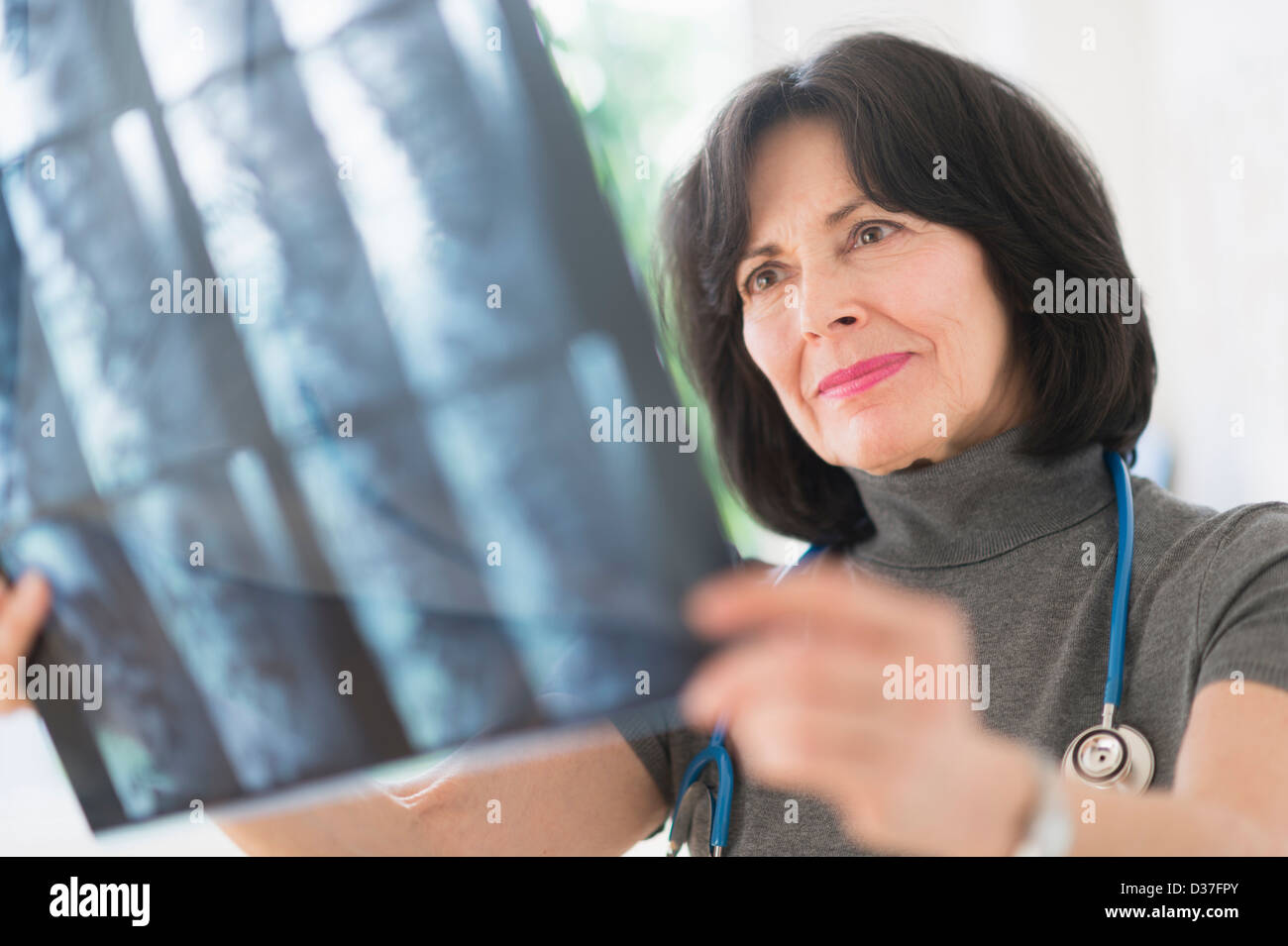 USA, New Jersey, Jersey City, Doctor looking at xray image Stock Photo