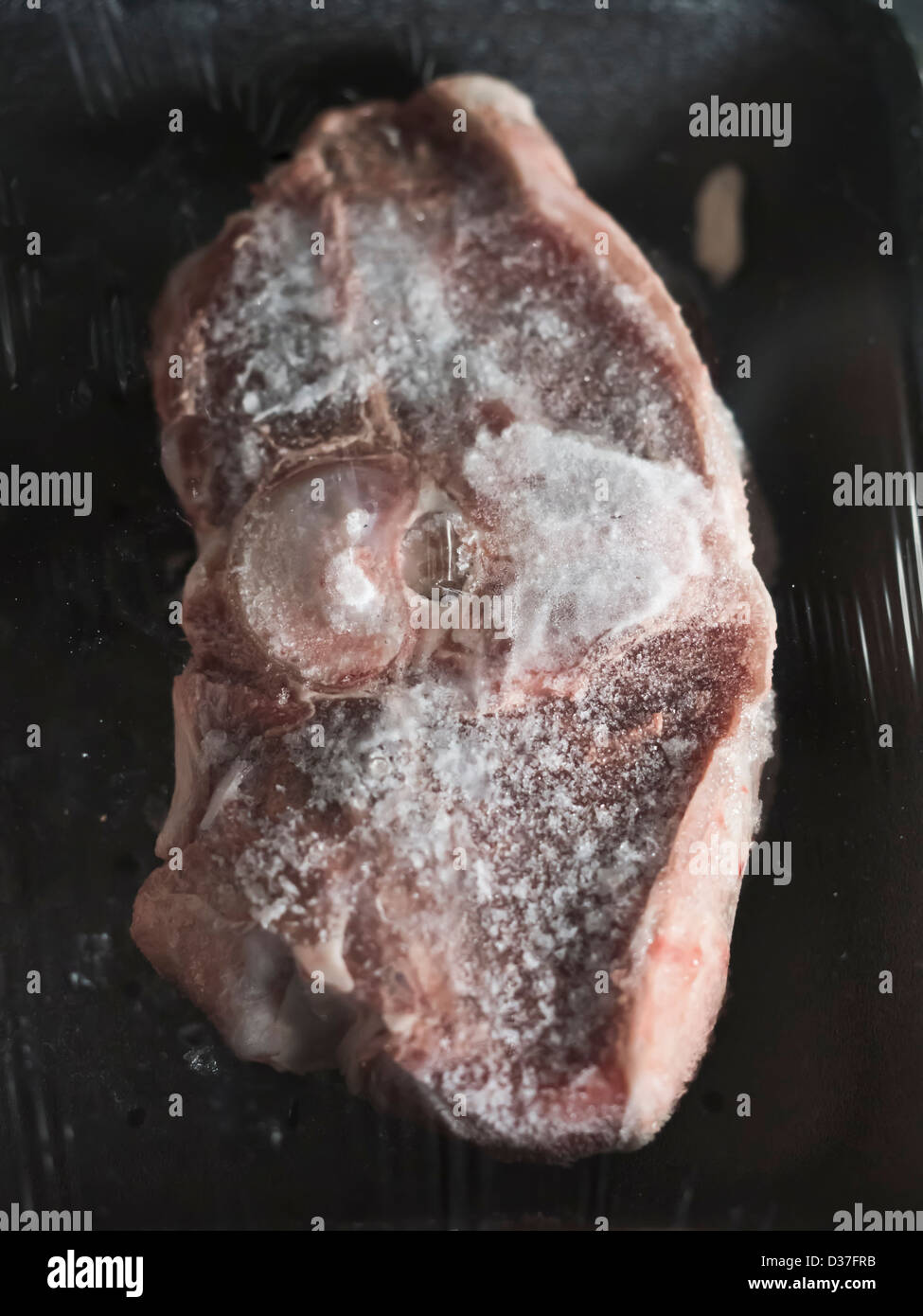 A frozen lambchop in its plastic packaging. Stock Photo