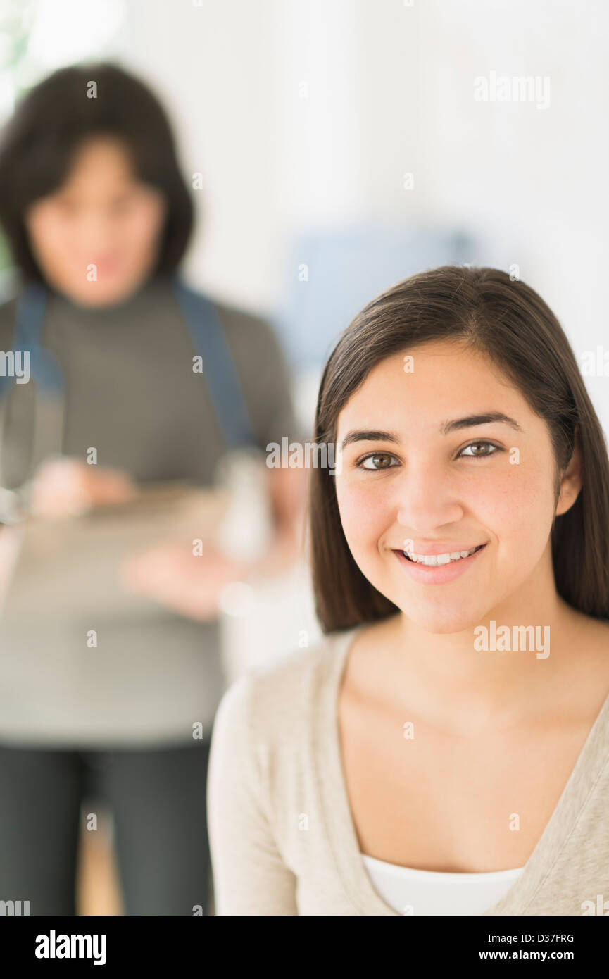 USA, New Jersey, Jersey City, Teenage girl (1617) in doctor's office