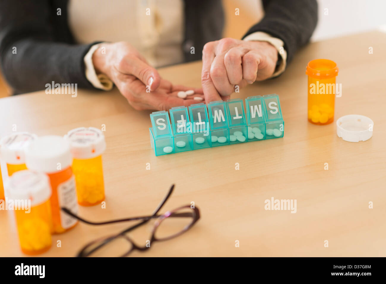 USA, New Jersey, Jersey City, Senior woman dozing pills Stock Photo
