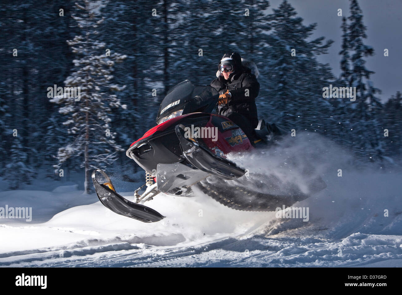 Snowmobile action, jumping on snow Stock Photo