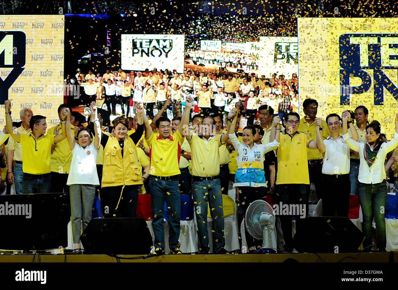 Manila, Philippines. 12th February 2013. Administration senatorial candidates together with Philippine President BENIGNO AQUINO III hold up their hands during a proclamation rally for their slate in the May congressional and local election in Manila, 12 February 2013. Senatorial candidates for the May 13 midterm elections kicked off their campaigns as the official start of the campaign period for national positions started. The campaign season is slated from February 12 to May 11, 2013. � Credit: Ezra Acayan / Alamy Live News Stock Photo