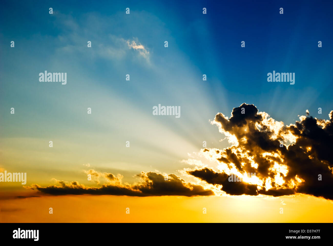 Solar beams make the way through clouds on a decline Stock Photo