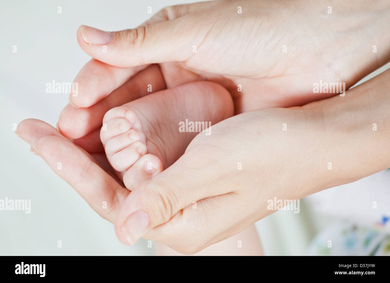 baby beautiful body care caucasian child childhood close closeup cute family finger foot hand holding human infant kid leg life Stock Photo