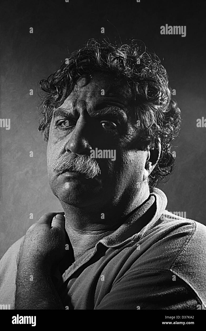weary middle-aged man, black and white Stock Photo