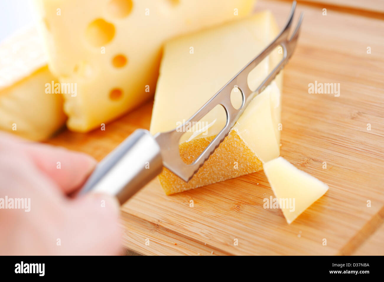 cheese with a cheese knife Stock Photo Alamy