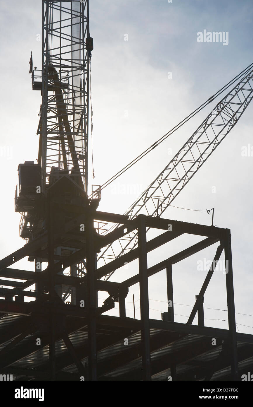 Crane over building under construction Stock Photo Alamy