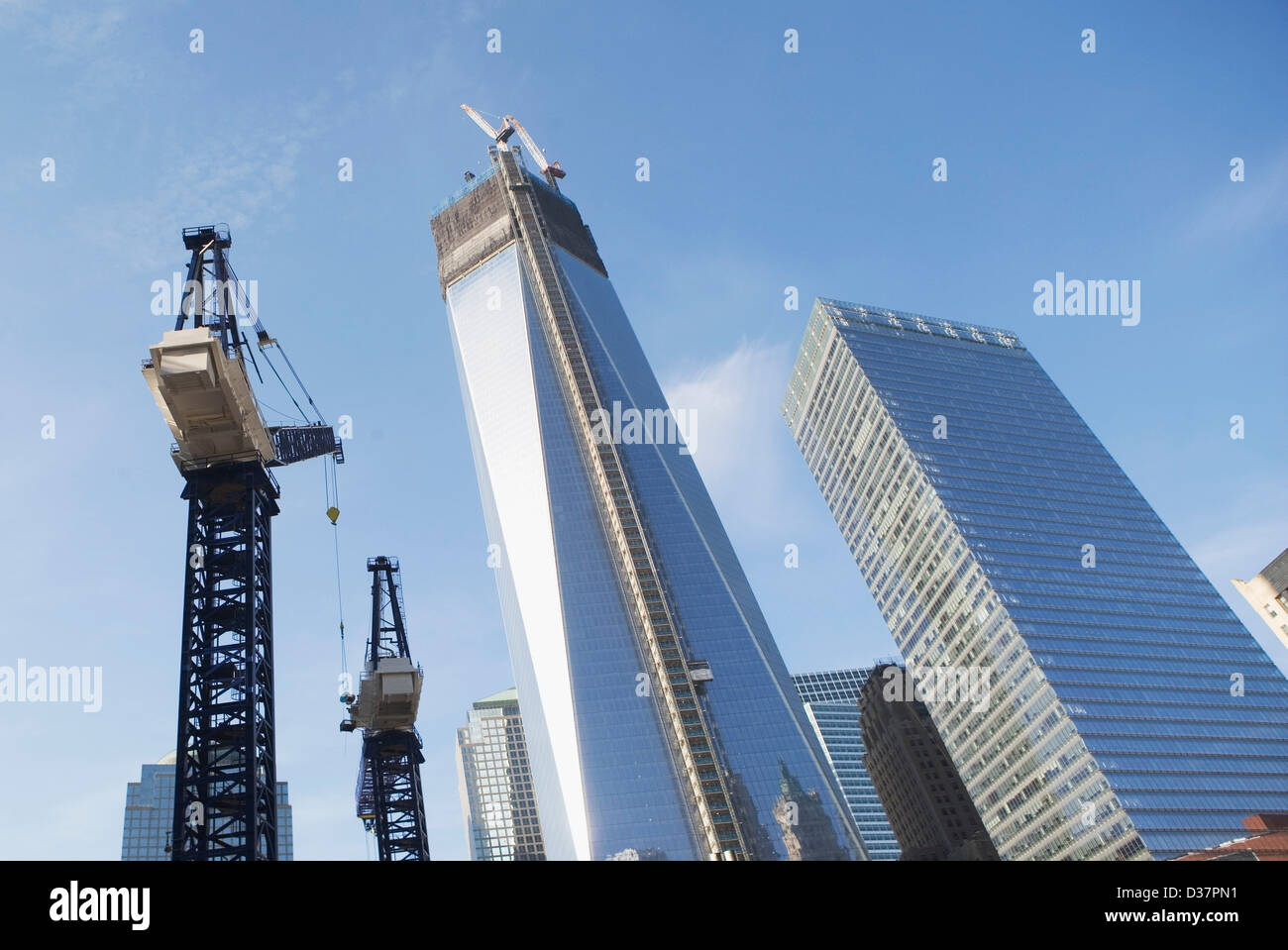 Low angle view of crane and skyscrapers Stock Photo