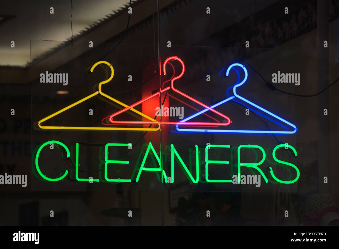 Neon sign reading 'cleaners' in window Stock Photo