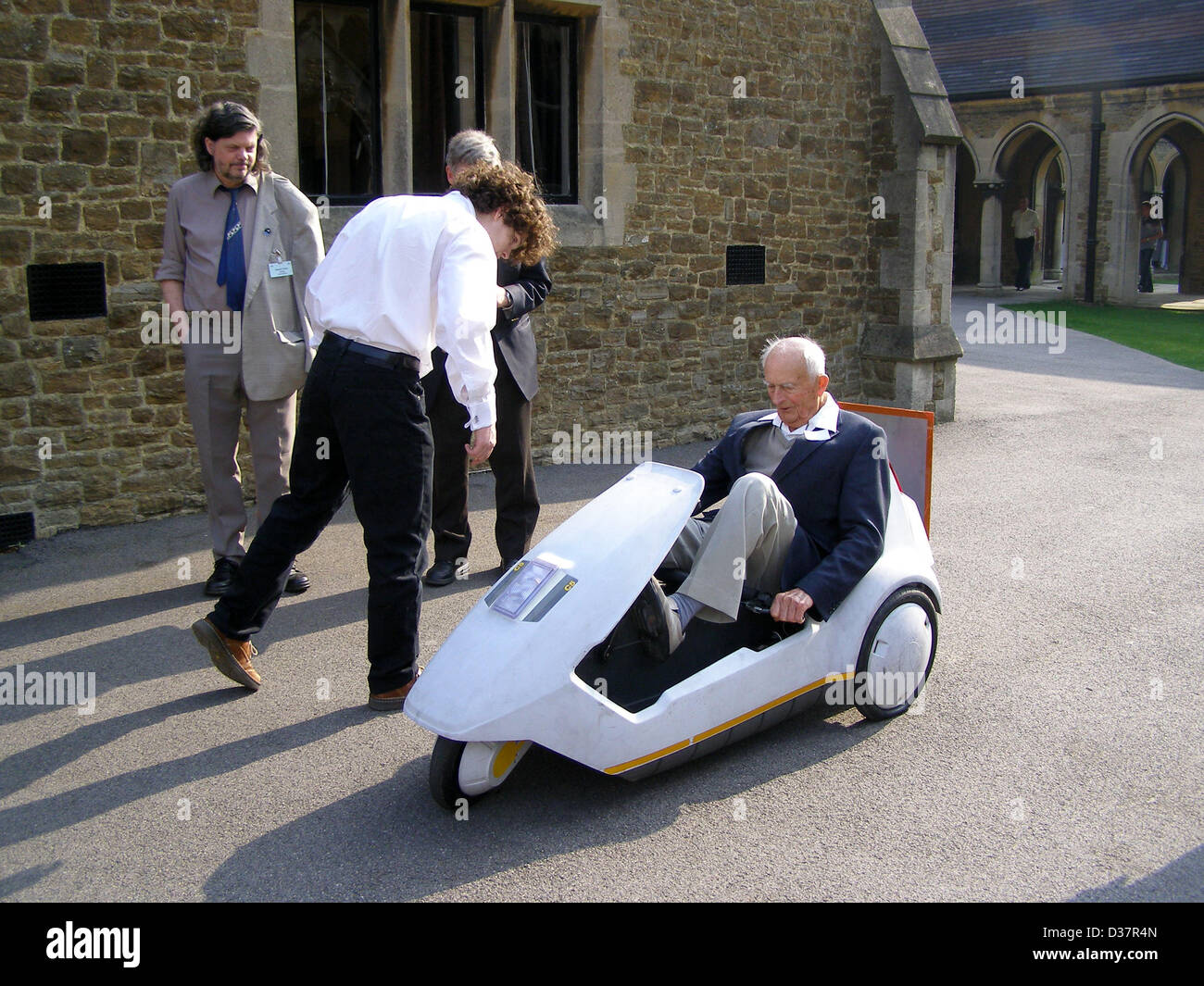 File Picture; Reg Turnill (1915-2013), aerospace correspondent for over 65 years,  pilots  a rocket-powered Sinclair C5 electric tricycle, at the British Rocketry Oral History Project conference in 2007, Charterhouse School, Surrey, England. UK. Mr Turnill passed away peacefully in the early hours of this morning, 12th Feb 2013, at the Pilgrim's Hospice in Ashford, where he had been for the past month. Also present: Jon London, Duncan Lunan Stock Photo
