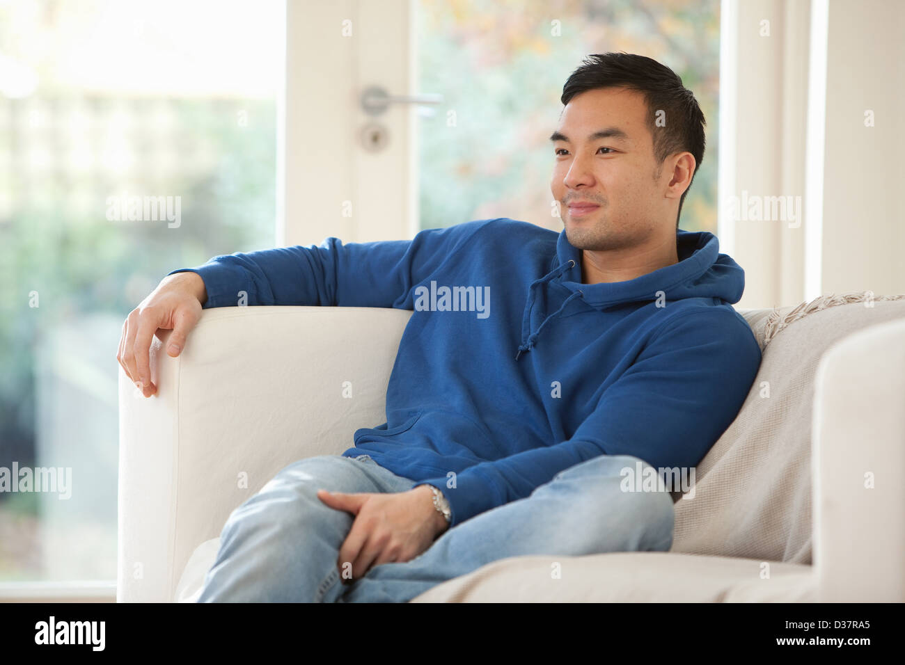 Relaxing man on sofa hi-res stock photography and images - Alamy