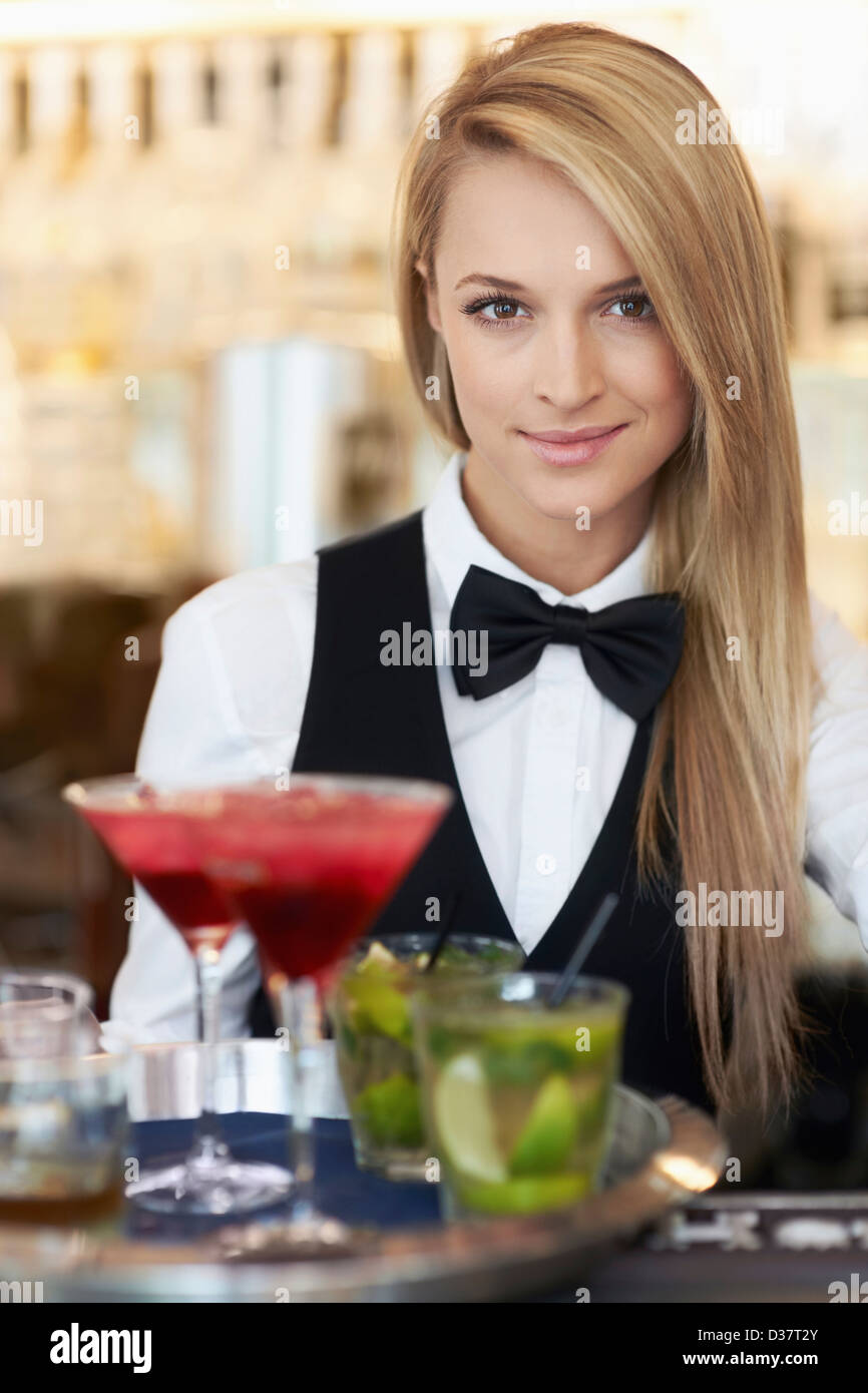 Woman holding tray cocktails hi-res stock photography and images - Alamy