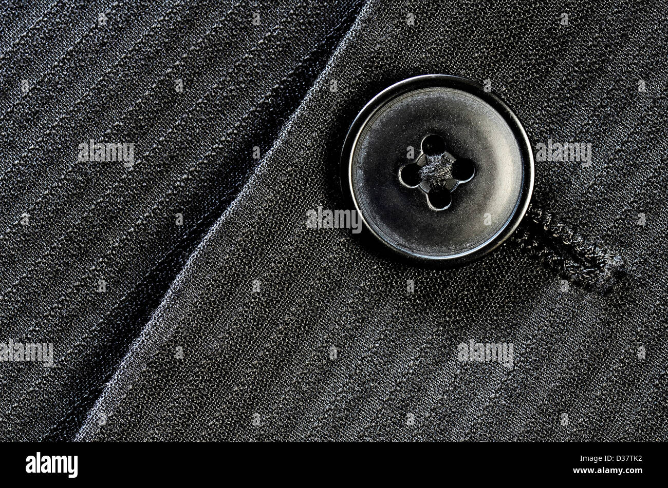 Detail of closeup of suit button on pin stripped cloth Stock Photo