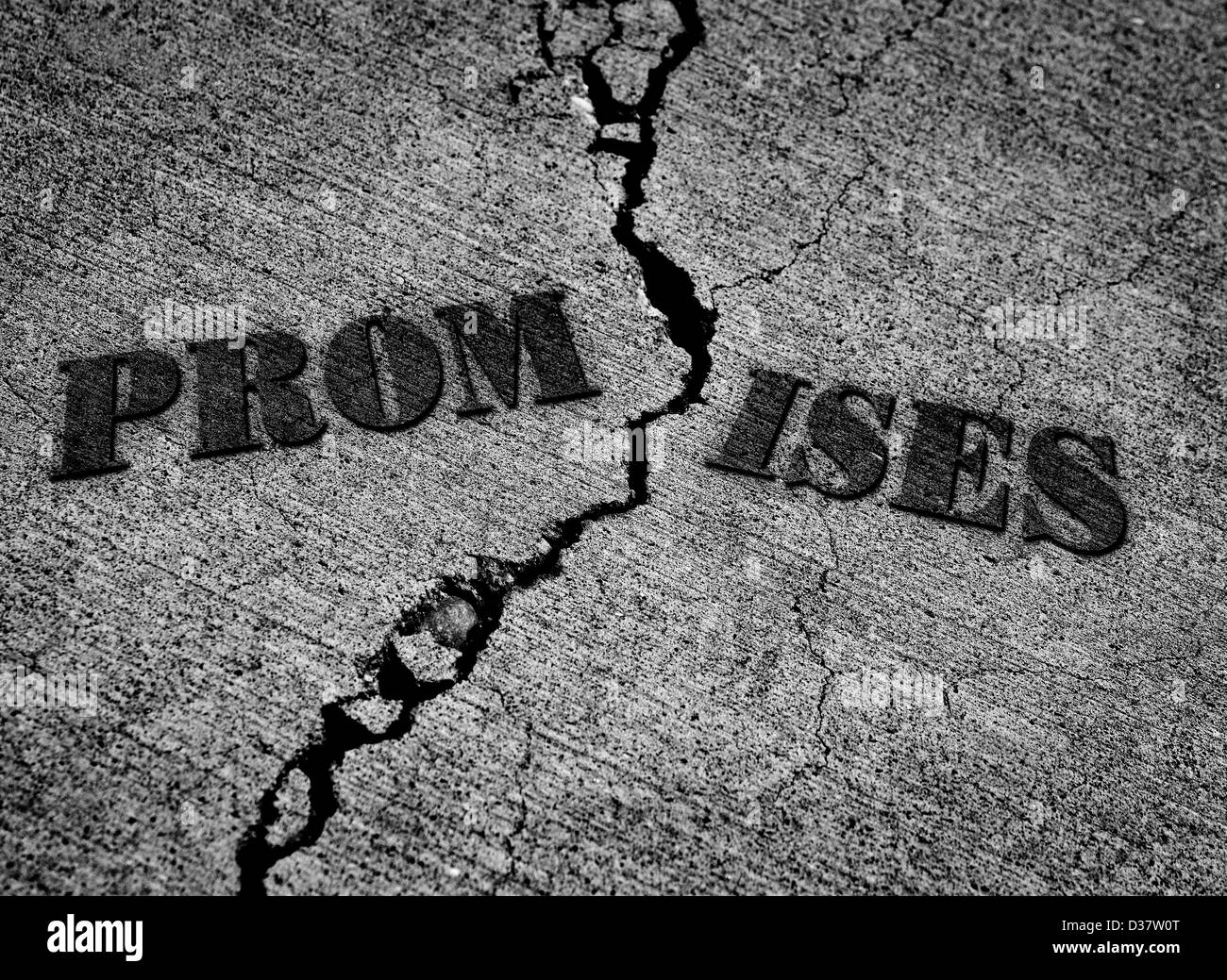 Broken promises with crack in concrete with words Stock Photo