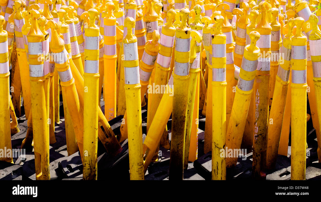 Pile of yellow caution cones used in road construction Stock Photo