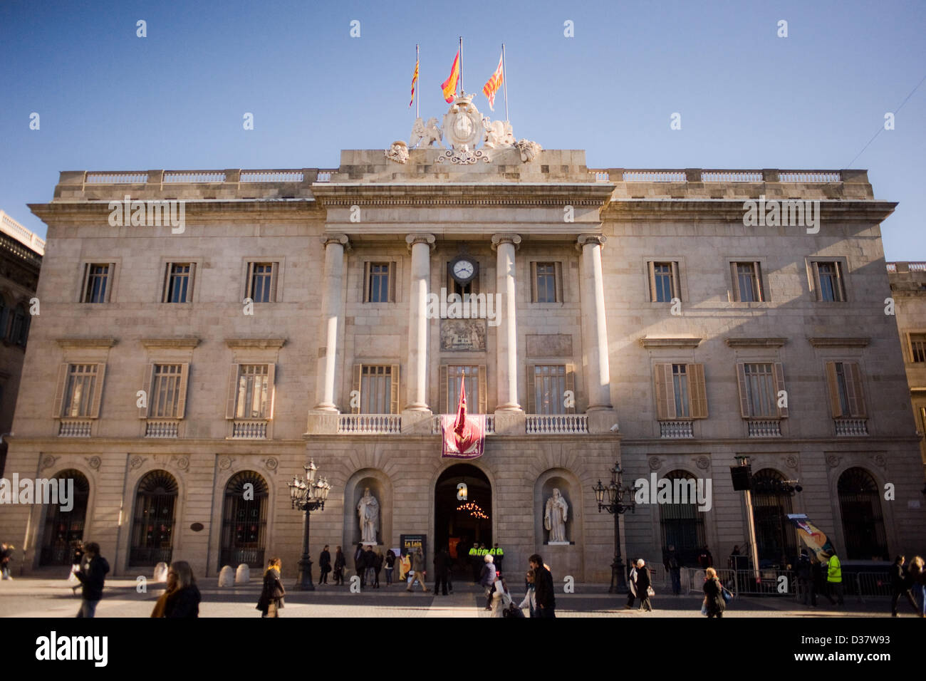 12 February , 2013-Barcelona, Spain. Neoclassical facade of the City of Barcelona.  La Casa de la Ciutat (in Catalan city house) is the building that houses the offices of the City of Barcelona. It has more than 6 centuries of history and architectural presence ranging from the Gothic to Neoclassical. Government offices and meeting rooms coexist with historic artwork in the form of sculptures, tapestries and paintings. These days, on the occasion of the celebration of the festival of Santa Eulalia (patron of the city with Santa Merce) remains open its doors to allow citizens to visit. Stock Photo