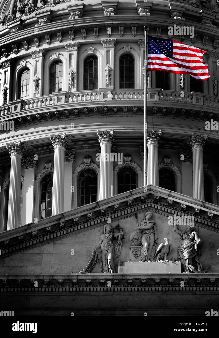 United State Capitol Building for congress with american flag flowing in breeze and columns in background Stock Photo