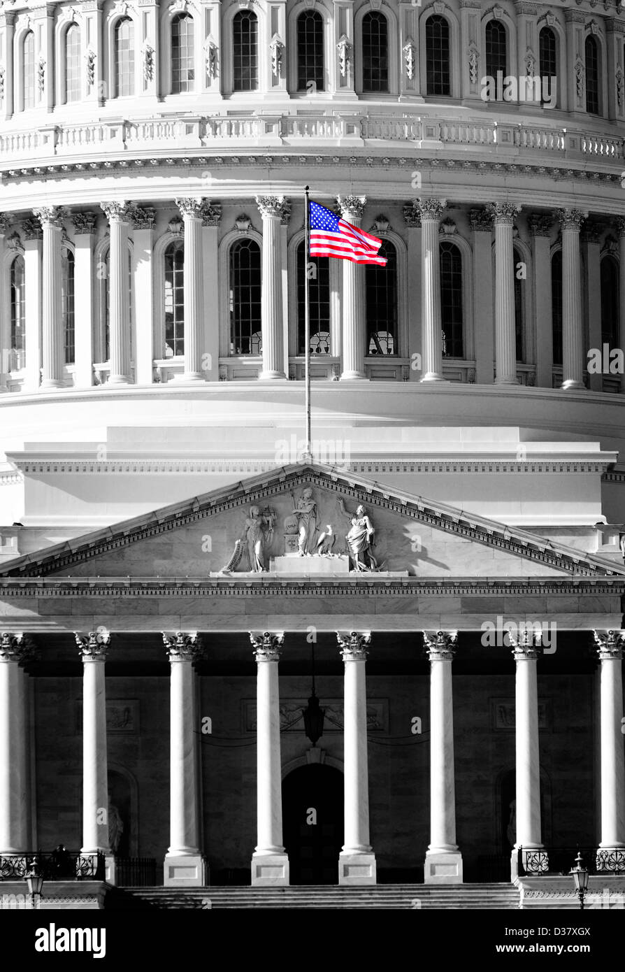 United State Capitol Building for congress with American flag flowing in breeze and columns in background Stock Photo