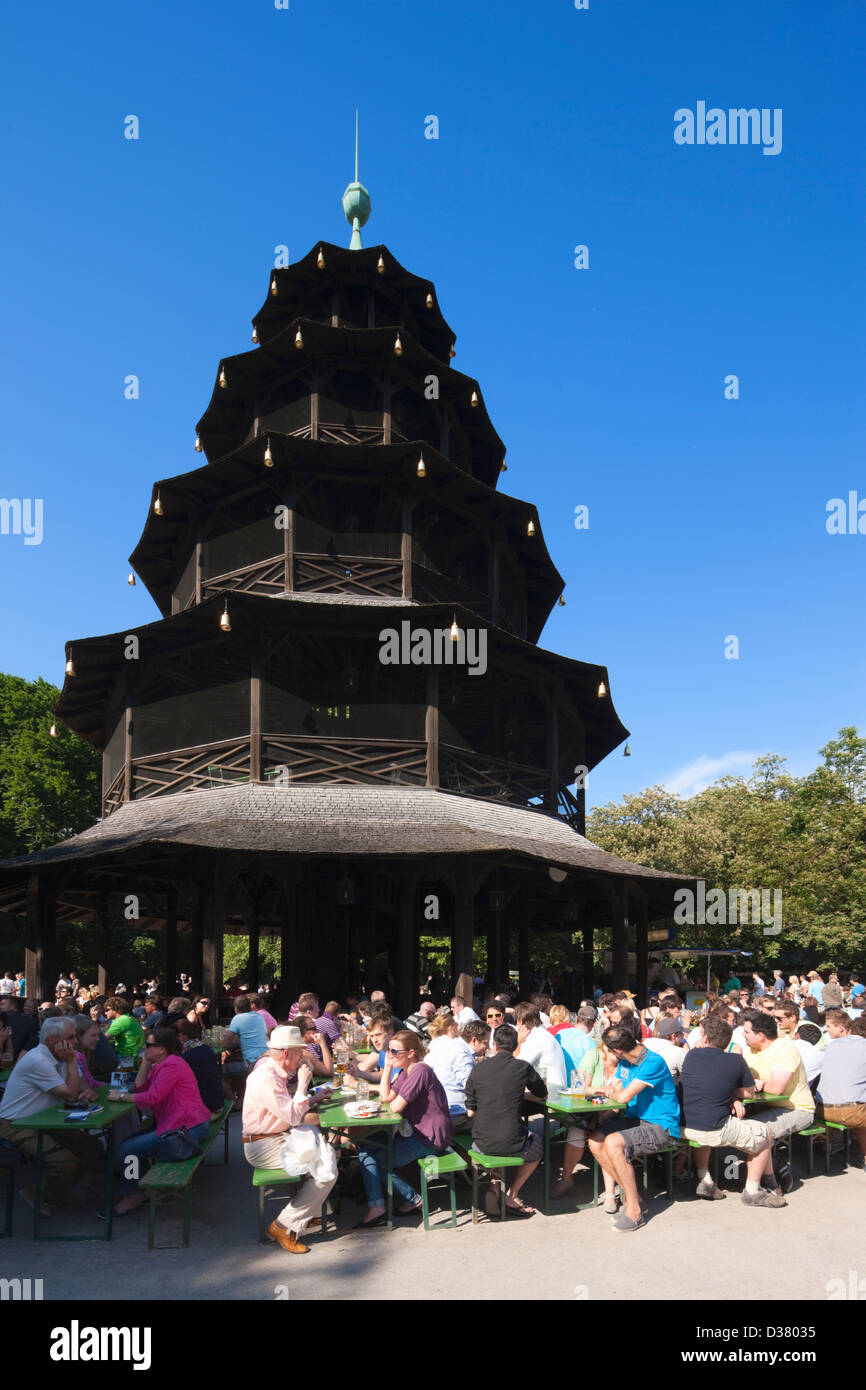 People drinking in The Chinese Tower beer garden, Englischer Garten, Munich, Bavaria, Germany Stock Photo
