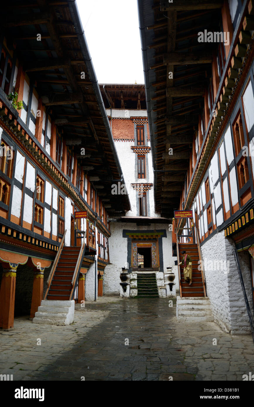 Bhutanese woman descends stairs from administrative offices in Jakar Dzong/fortress,36MPX,HI-RES Stock Photo