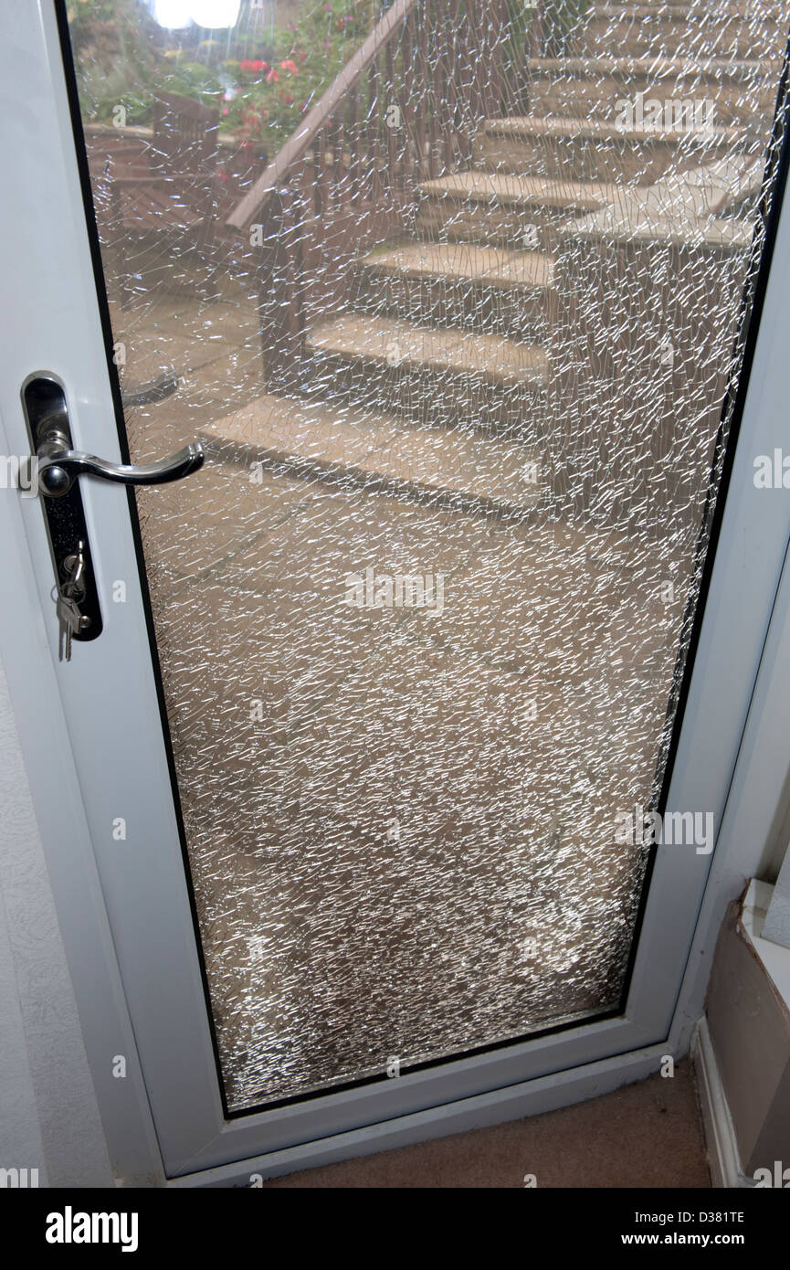 Smashed broken double glazed door fire heat Stock Photo Alamy