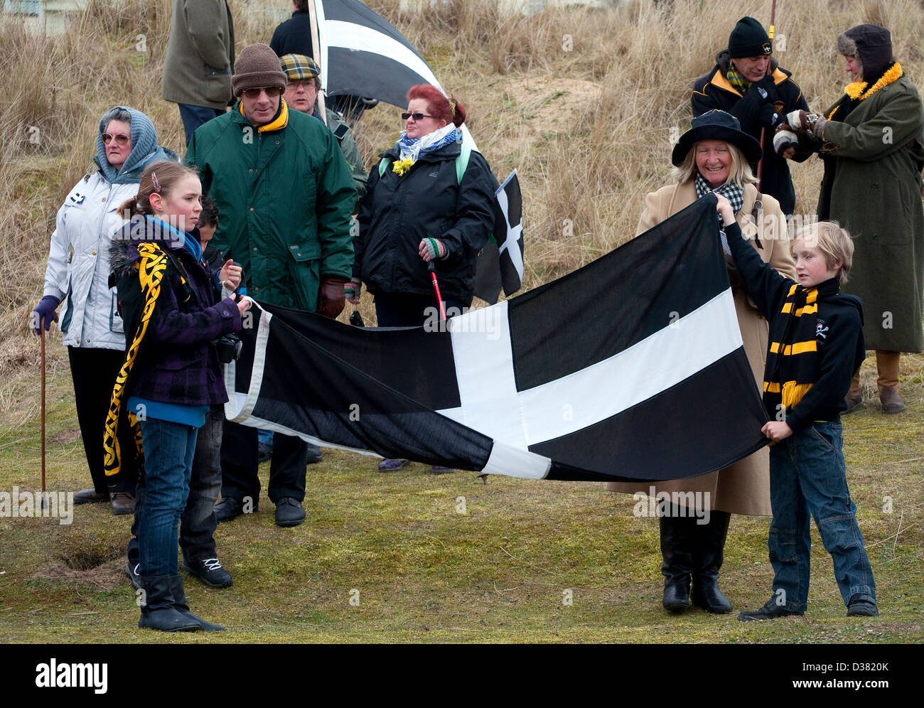 a family with the cornish flag on st.pirans day in cornwall, uk Stock Photo