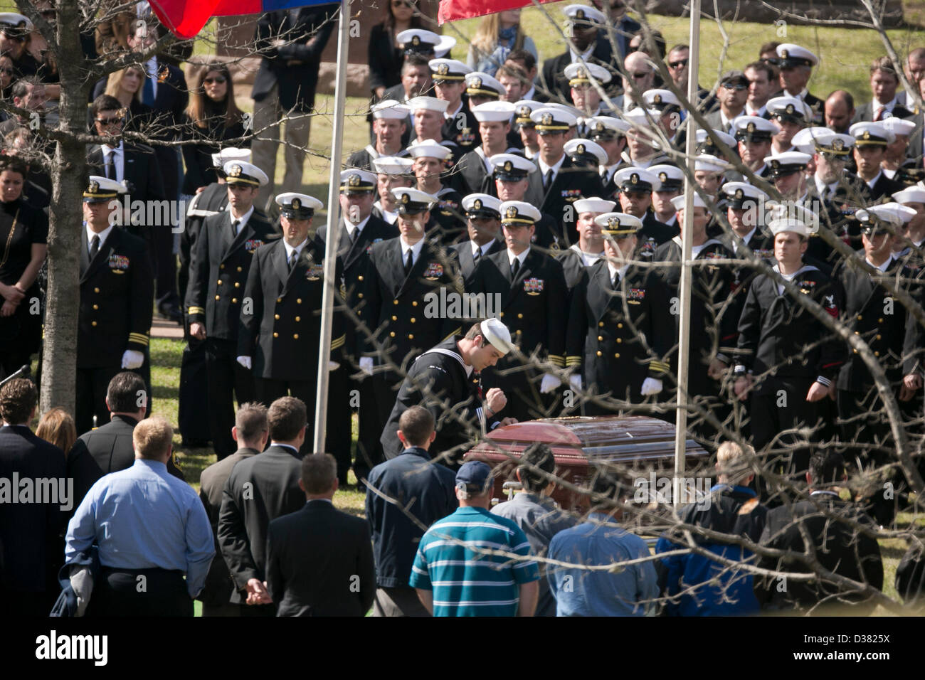 Members of U.S. Navy SEAL Team Ten stand at attention during funeral