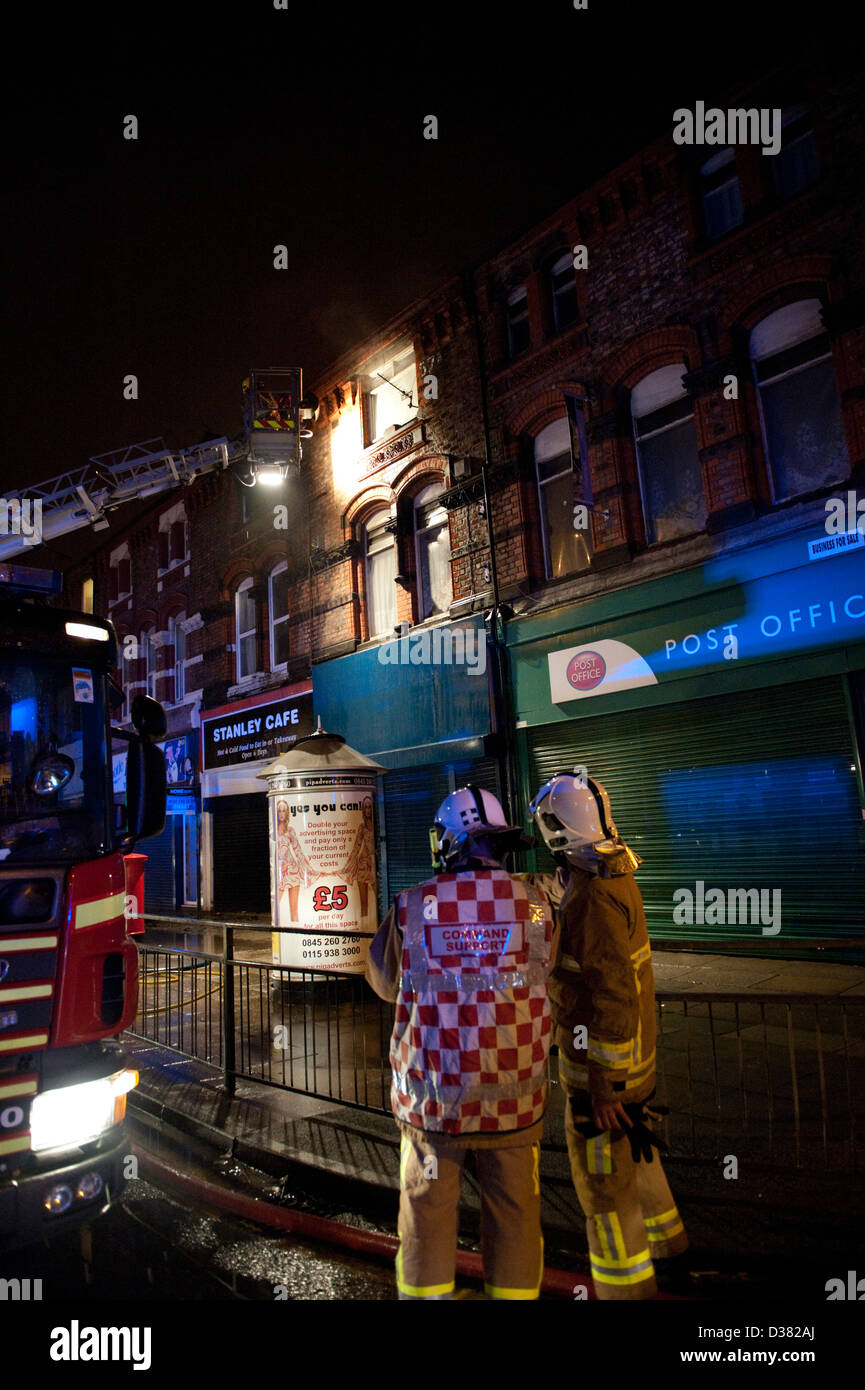 Fire Officers at flat above shop fire at night Stock Photo Alamy