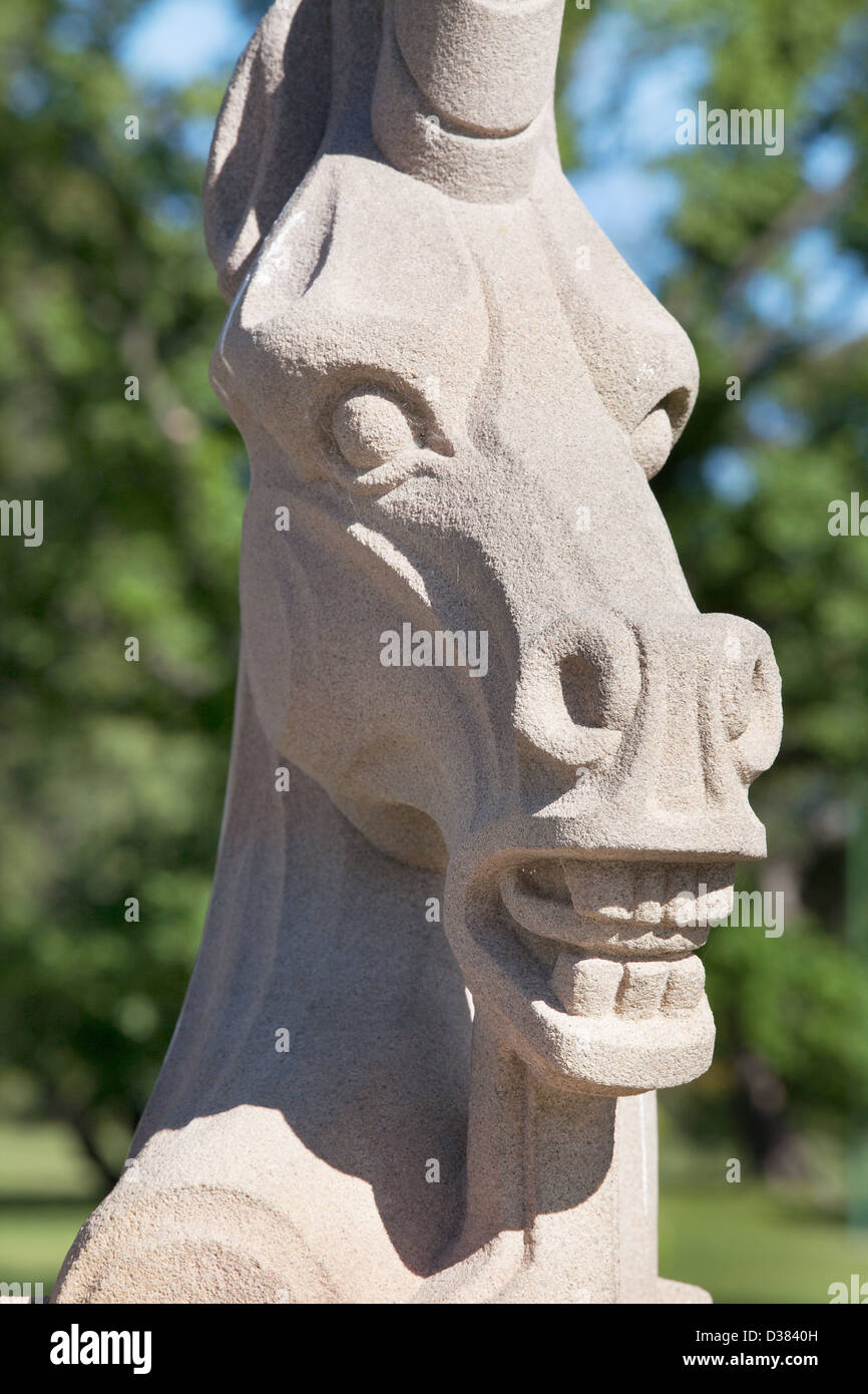 chess piece stone horse head / face in a park in Melbourne Australia Stock Photo