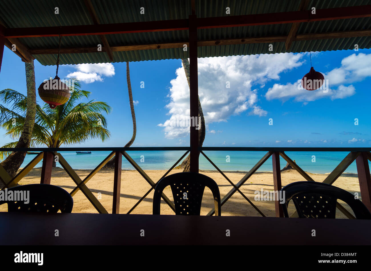 View of white sand beach from inside restaurant in San Andres y Providencia, Colombia Stock Photo