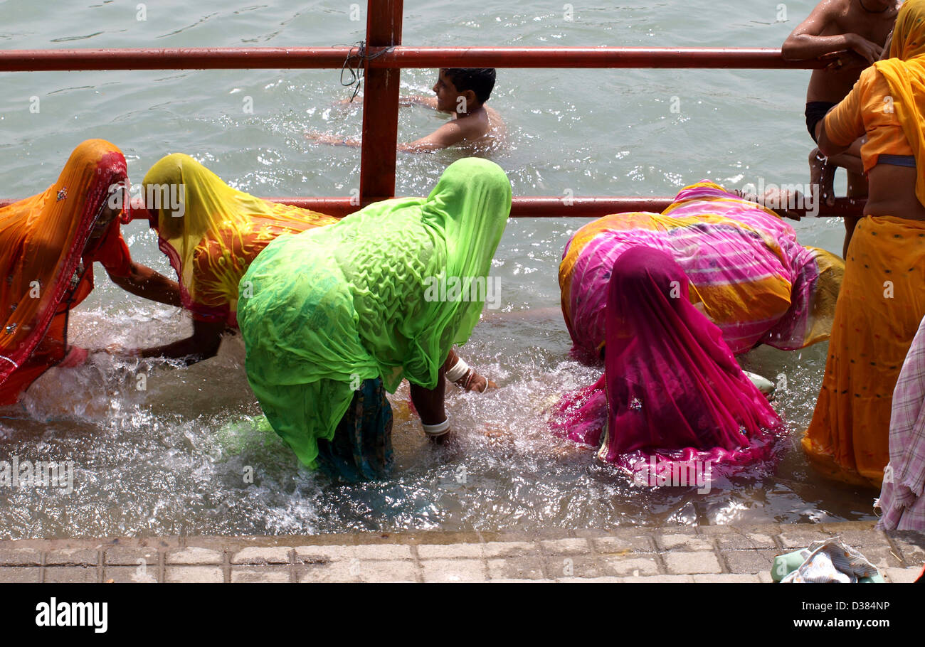 Women Bathing In The Ganges River At The Third Shahi Snan Kumbh Mela In Har Ki Pauri Haridwar 