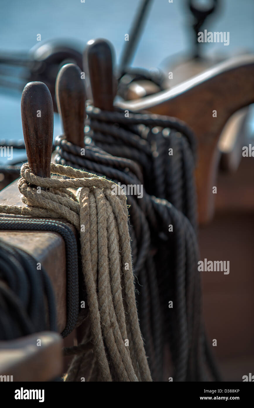 Selective focus of the belaying pins wound with rope on a 19th century