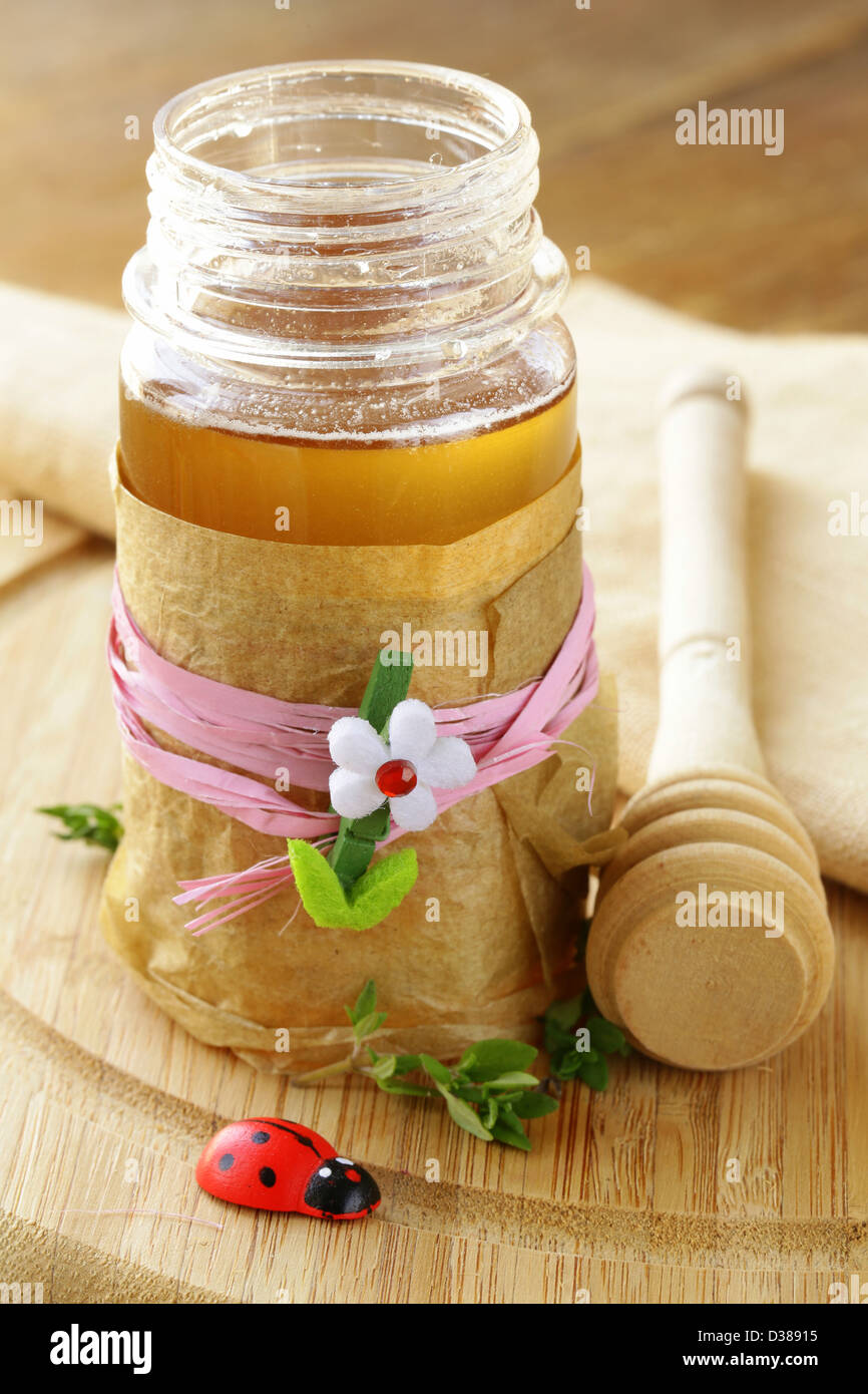 Natural organic flower honey in the pot Stock Photo