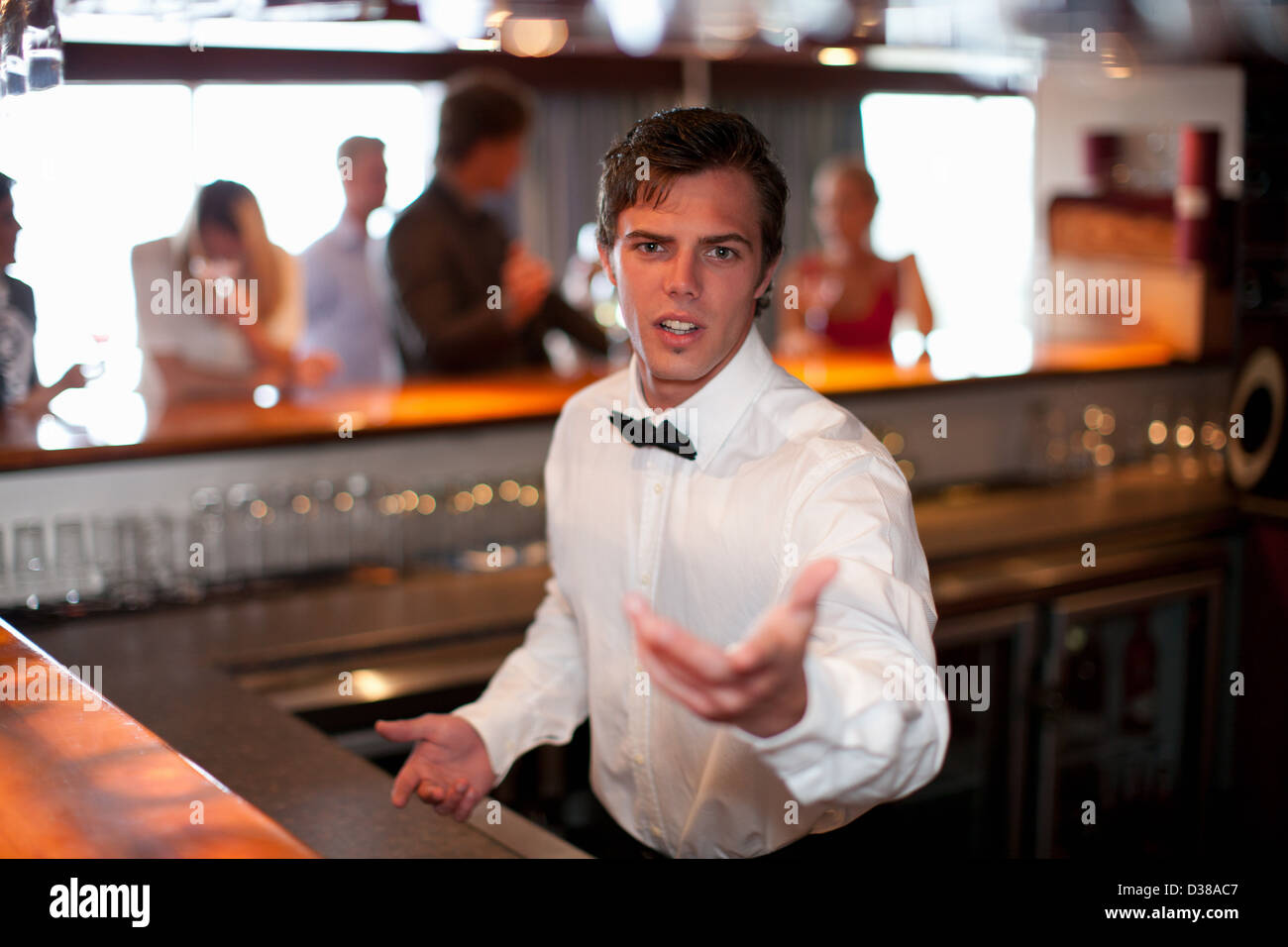 Waiter taking order at restaurant bar Stock Photo Alamy