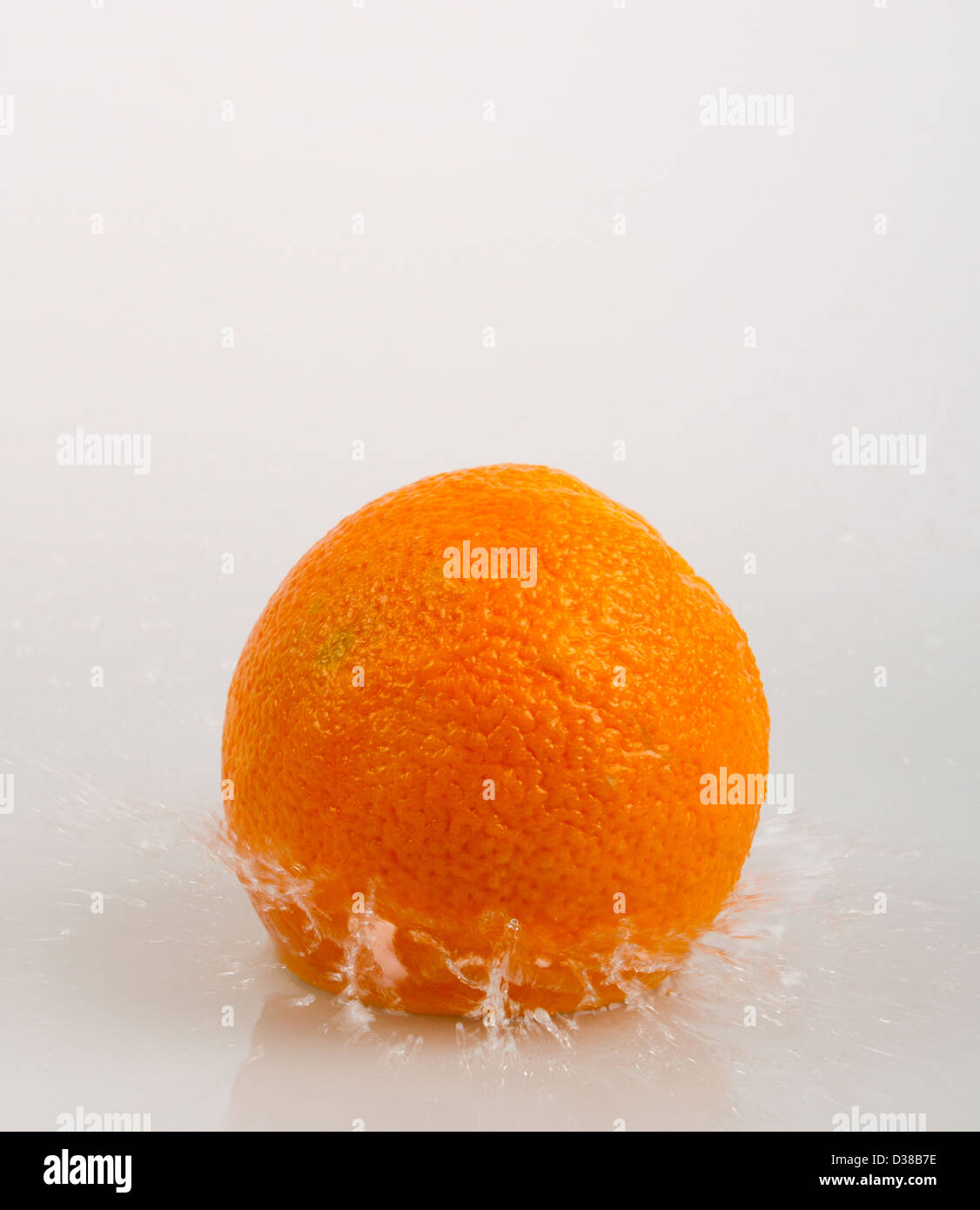 Orange fruits and Splashing water Isolated on white background Stock ...