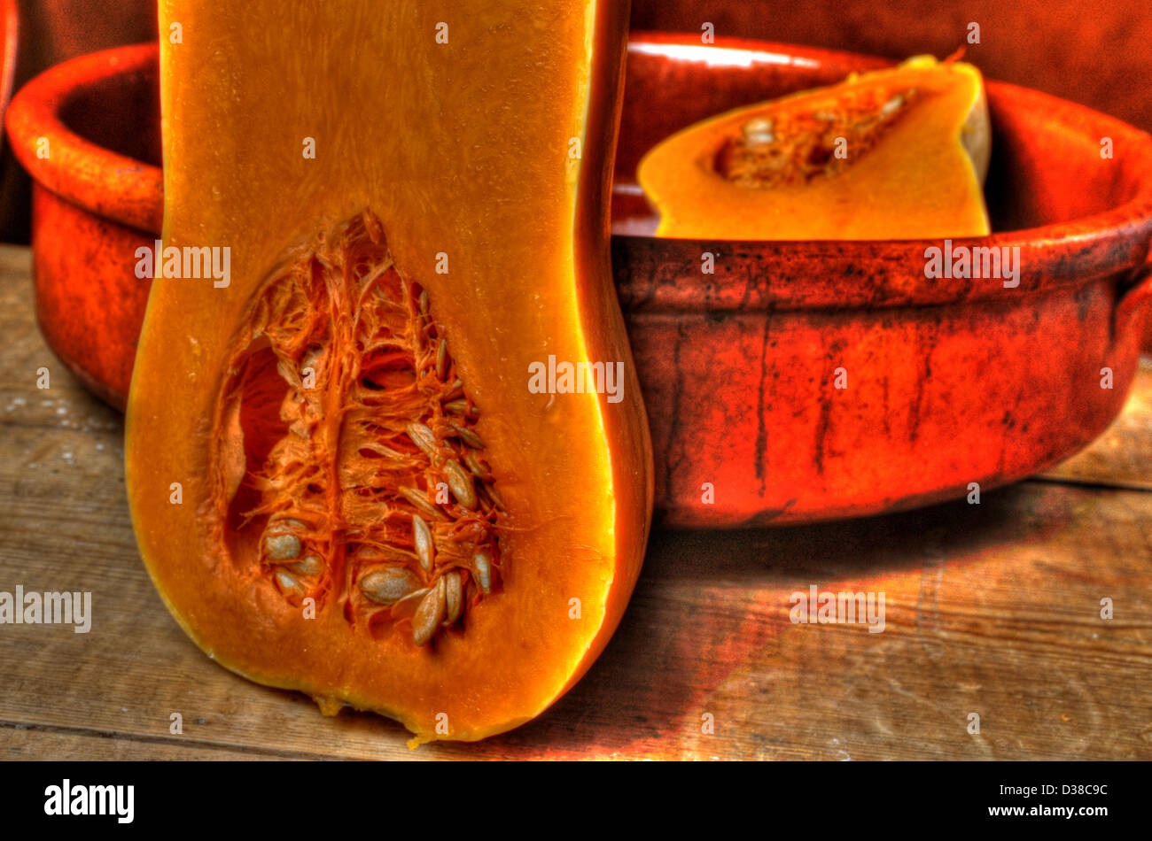 Halved butternut squash showing seeds in baking tien Stock Photo Alamy