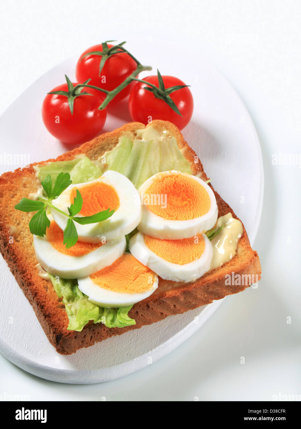 Open faced egg sandwich studio Stock Photo Alamy