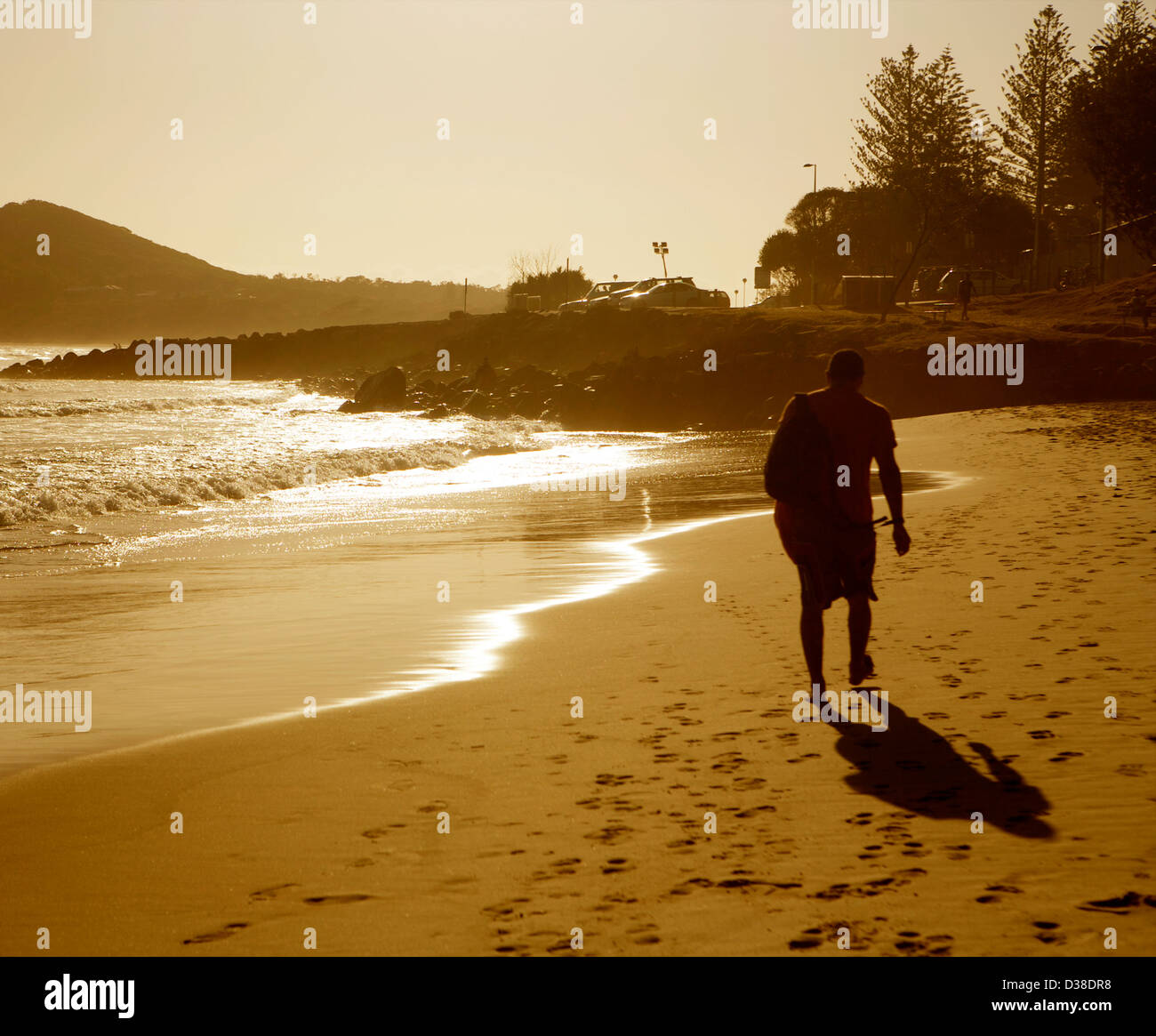 walker on the beach Byron Bay, NSW, Australia Stock Photo