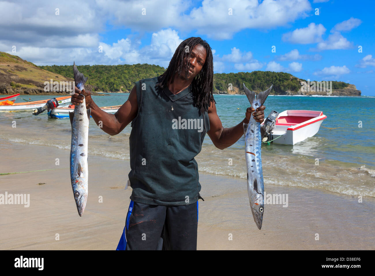 Local fisherman with fish from a fresh catch at Savannes Bay, St Lucia Stock Photo