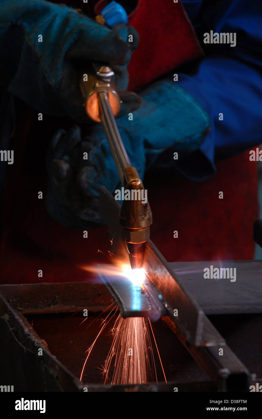 Man welding, fabrication, construction, building, sparks, danger, recession, engineering, making, work, employment, gdp, Stock Photo