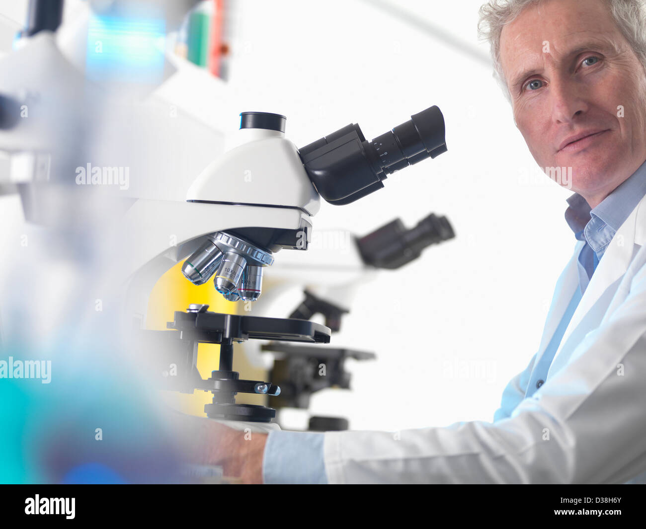 Scientist using microscope in lab Stock Photo Alamy