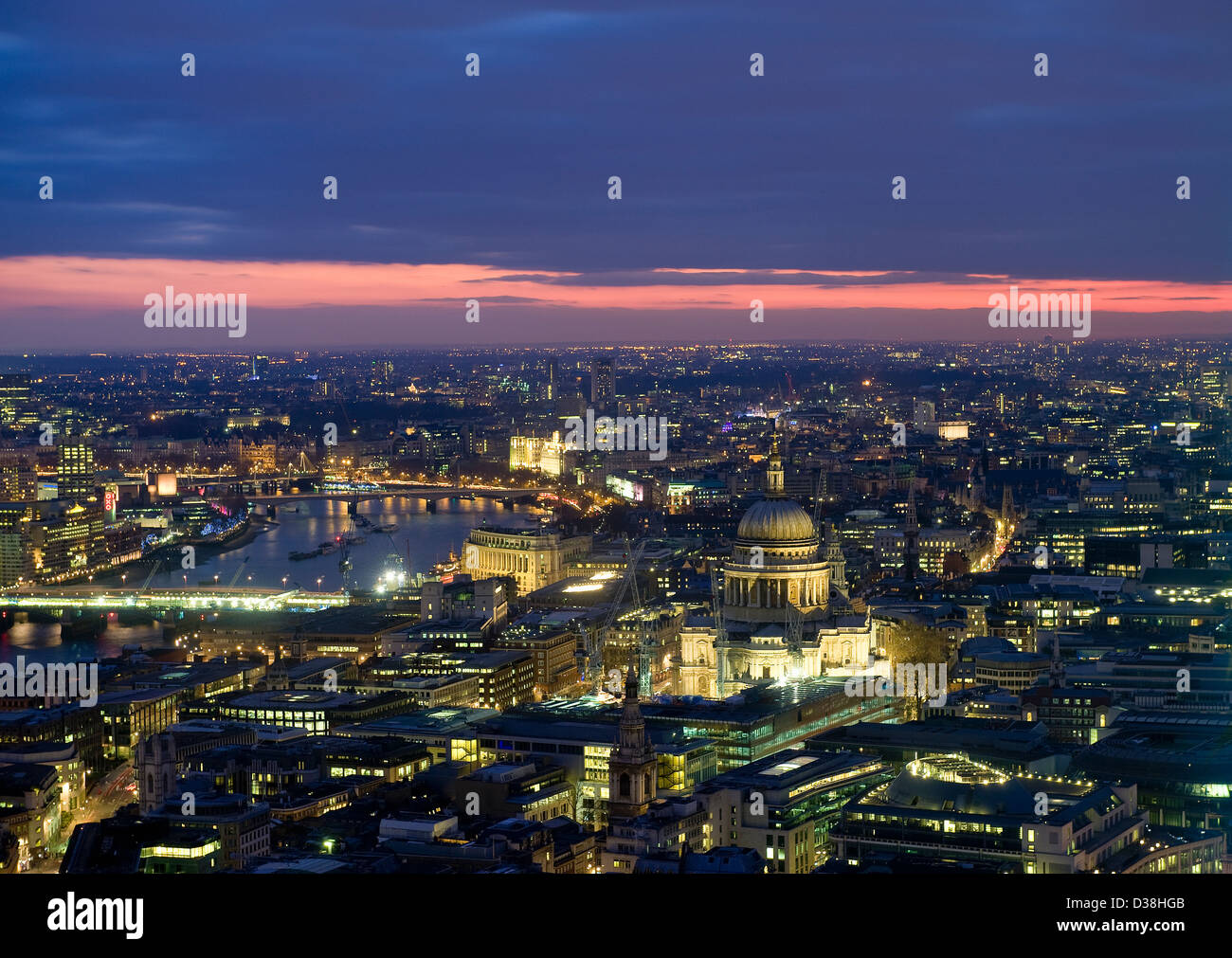 Aerial view of cityscape lit up at night Stock Photo