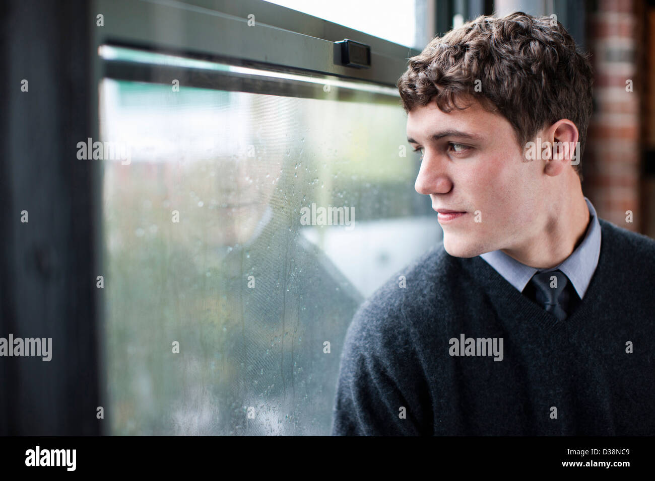 Businessman looking out window Stock Photo