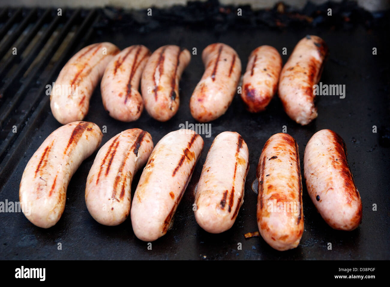 Sausages cooking on a BBQ Stock Photo Alamy